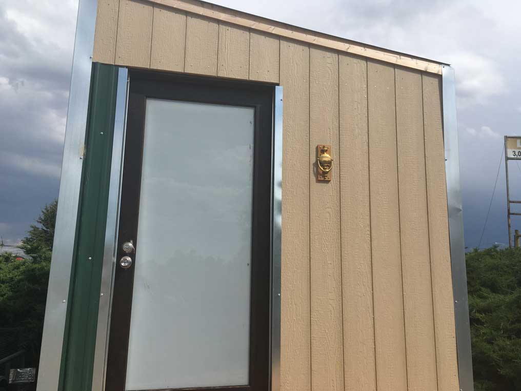 A photo of the front door of my tiny house
